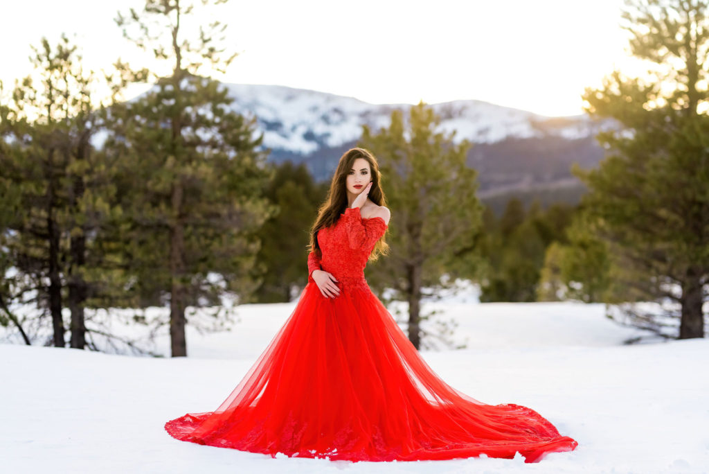 Wearing a ballgown in the snow for portraits