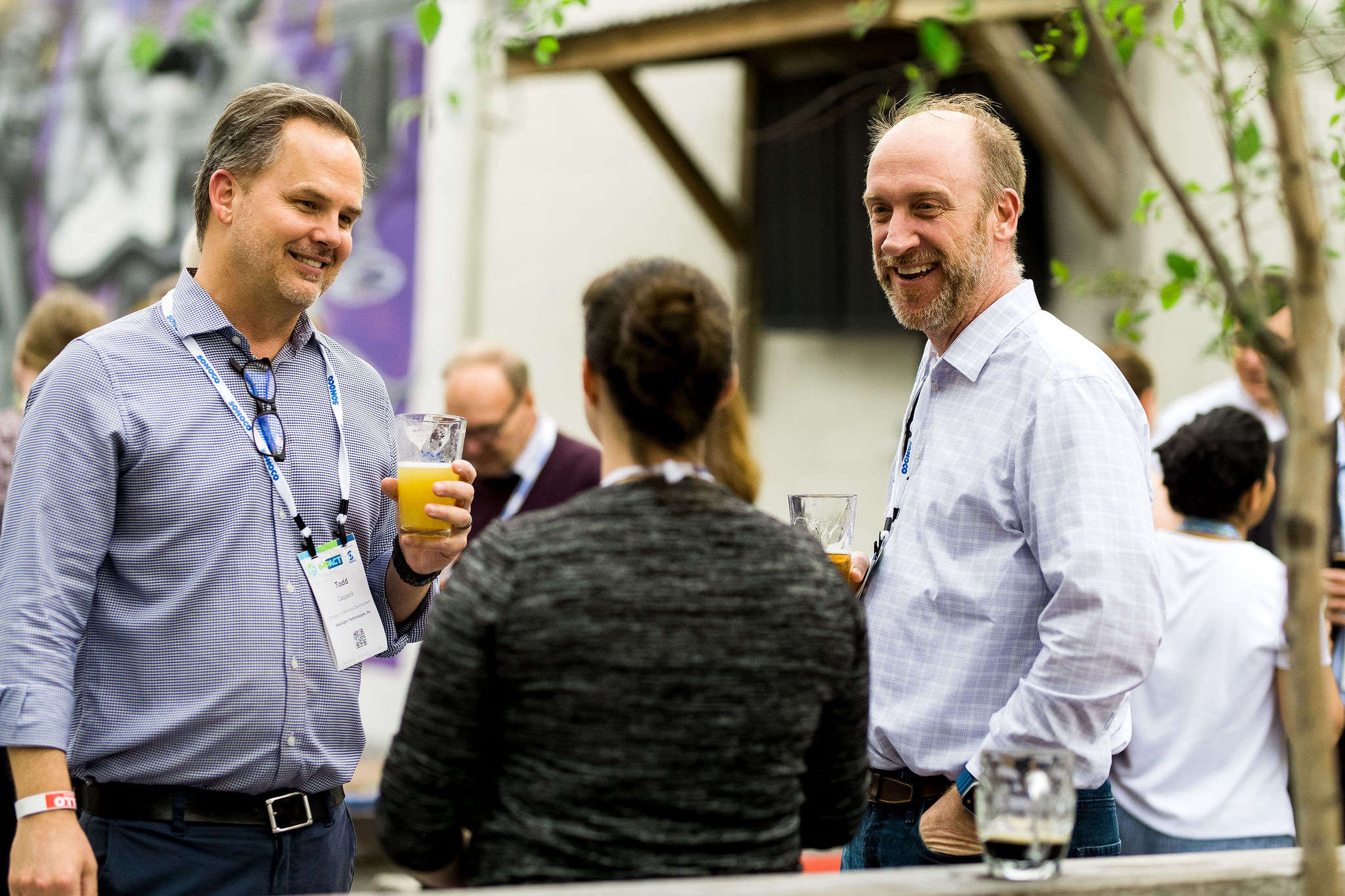 Attendees network during the evening off-site social event during a corporate event.