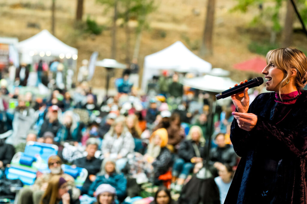 Ellen Mara on stage at Stone Family Field Trip at the Zephyr Lodge Liberty Lake.