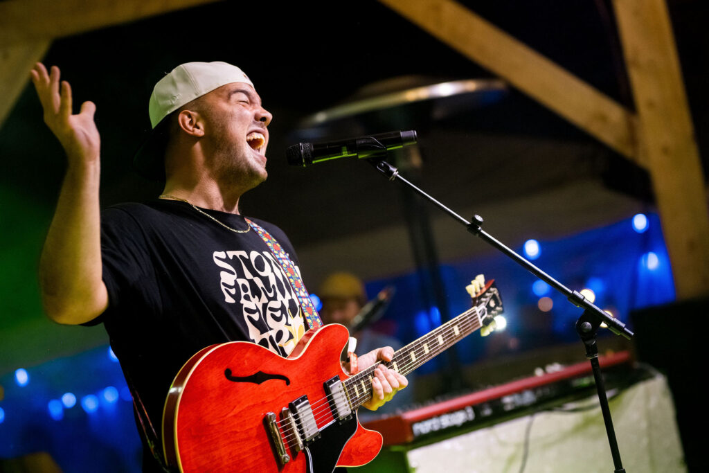 Mac Ayres on stage at Stone Family Field Trip at the Zephyr Lodge Liberty Lake.