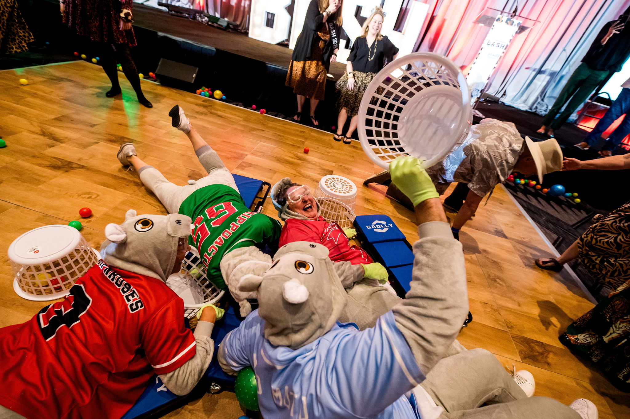 Attendees at Cornerstone Impact play a human sized game of hungry hungry hippos