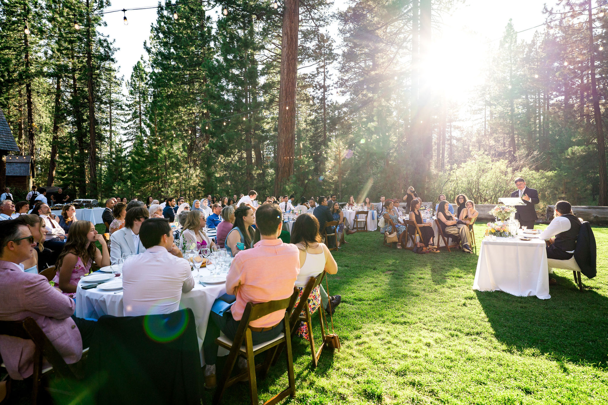 Outdoor sunset dinner wedding reception