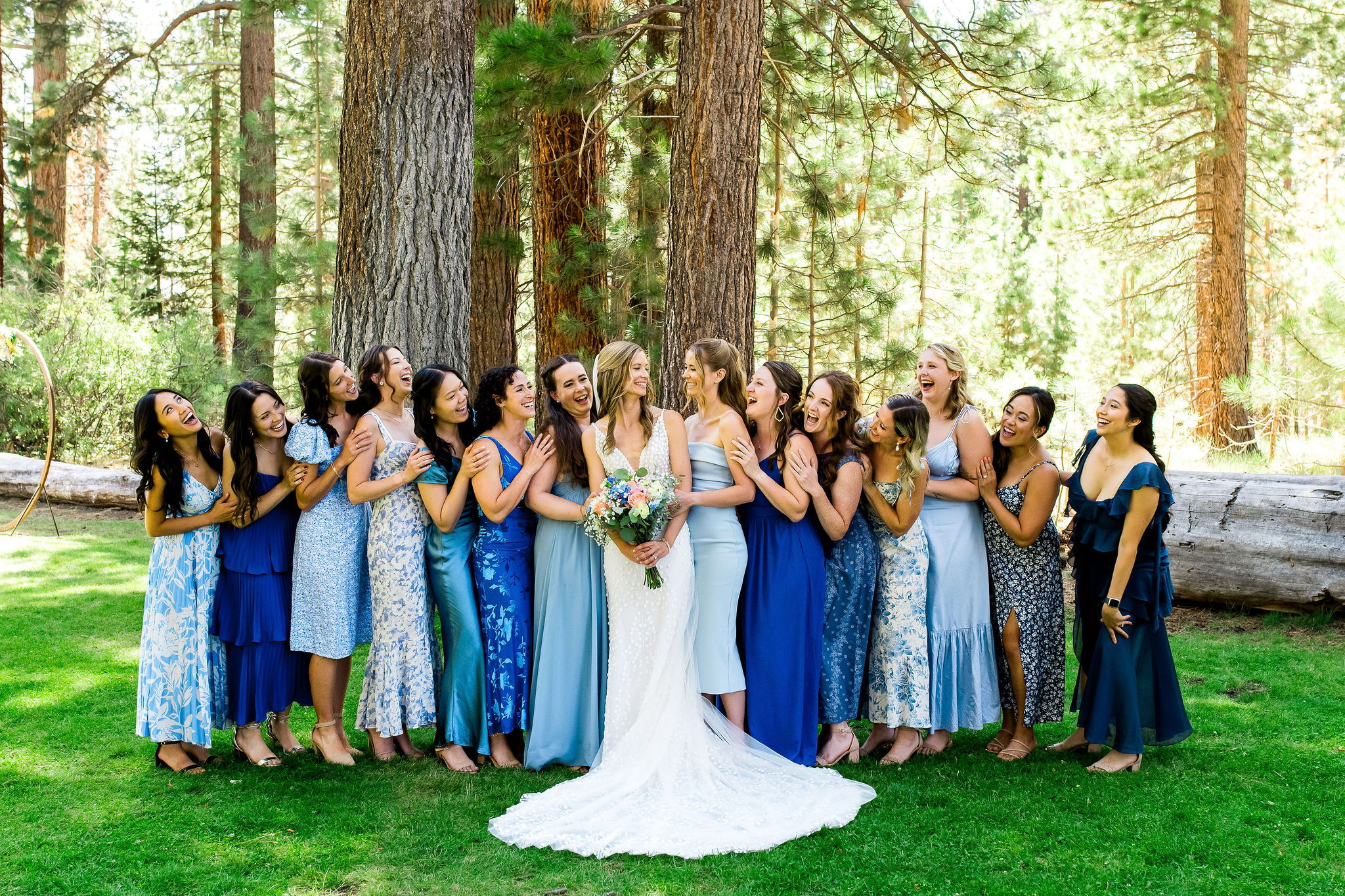 Wedding party in dresses in shades of blue