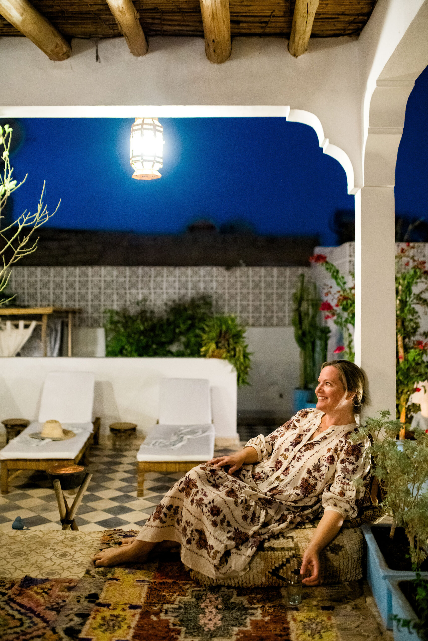 woman lounges on patio