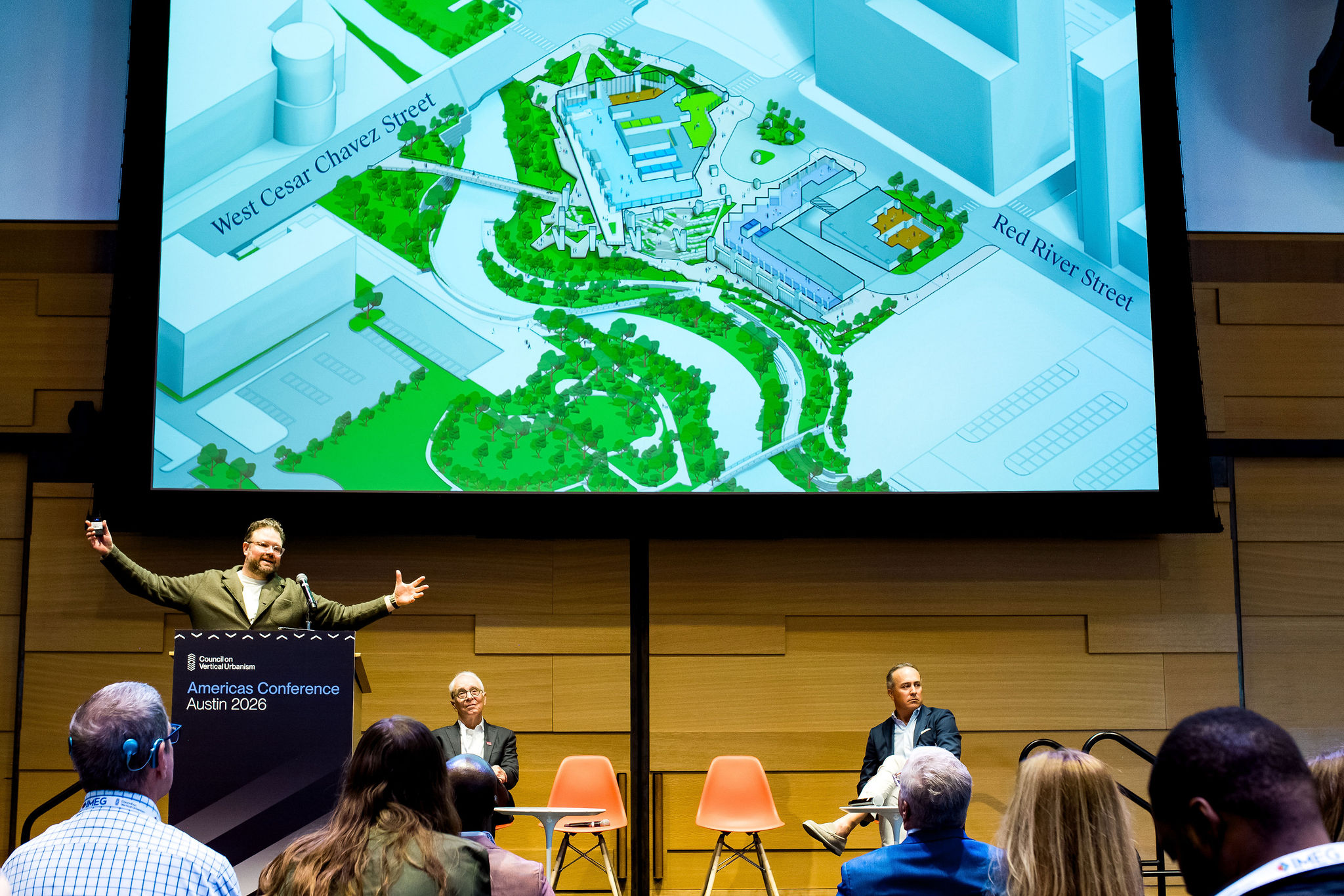 Conference presenter in spotlight during live talk