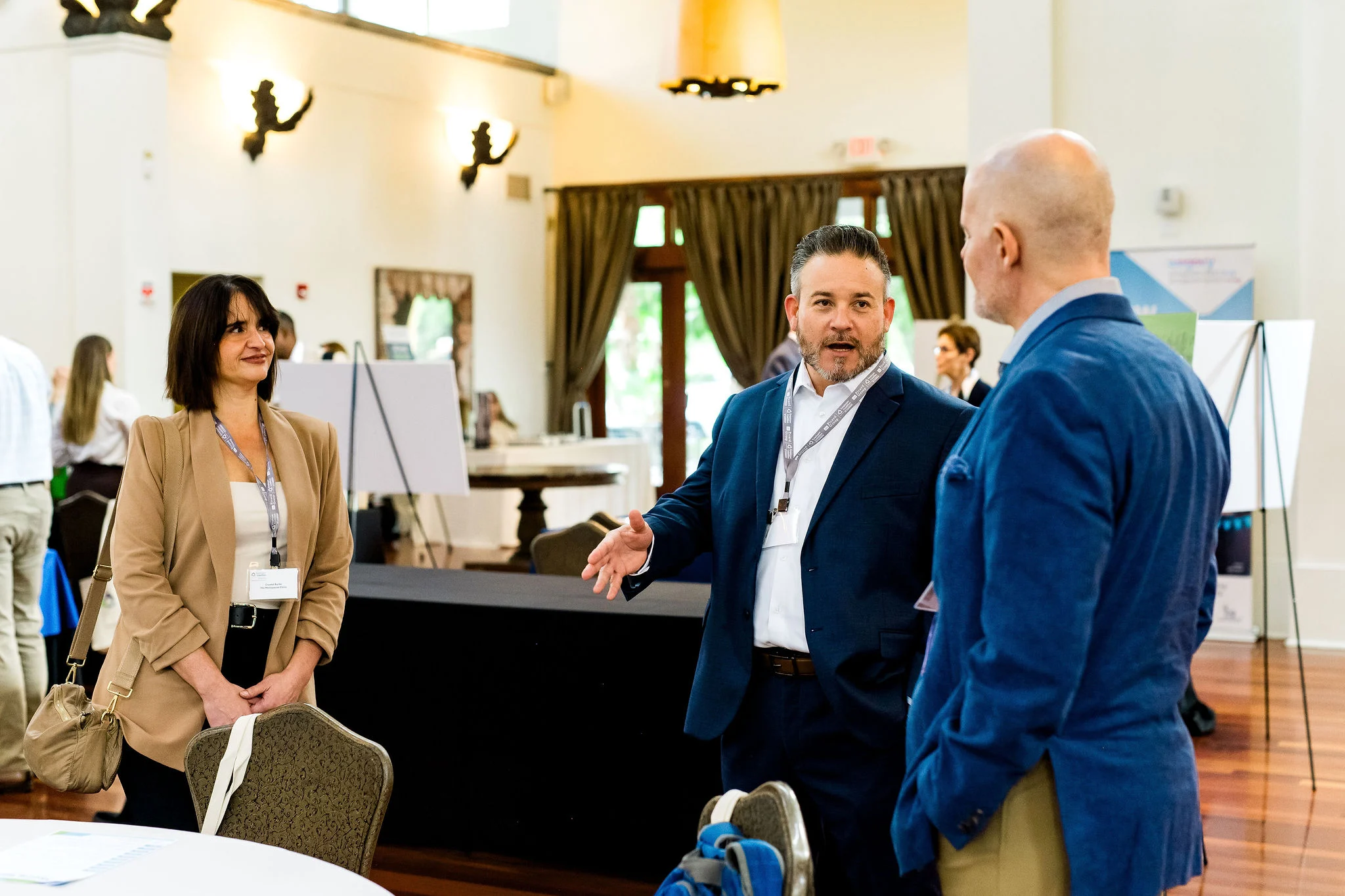Spring-Forum Attendees networking during a break at the Audubon Tea Room, a New Orleans corporate event venue